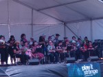 Music lesson: TeachUke in action on the main stage. Kevin is front row centre in the green flowery shirt.